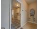 Entryway featuring stylish tile flooring leading into a room with cabinetry at 5118 N Pratt St, Covington, GA 30014