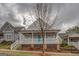 Beautiful home featuring a covered front porch and inviting curb appeal at 5118 N Pratt St, Covington, GA 30014