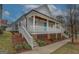 Charming home with a welcoming front porch and a bright blue front door at 5118 N Pratt St, Covington, GA 30014