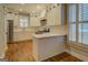 Stylish kitchen featuring white cabinetry, quartz countertops, and stainless steel appliances at 5118 N Pratt St, Covington, GA 30014