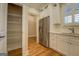 Bright kitchen features stainless steel refrigerator and quartz countertops, and pantry at 5118 N Pratt St, Covington, GA 30014