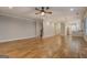 Bright living area with hardwood floors, a ceiling fan, and easy access to the kitchen at 5118 N Pratt St, Covington, GA 30014