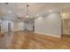 Open-concept living space featuring hardwood floors and seamless transition to other areas of the home at 5118 N Pratt St, Covington, GA 30014