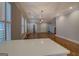 Bright, open-concept living room features hardwood floors, plantation shutters and a fireplace at 5118 N Pratt St, Covington, GA 30014