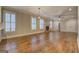 Spacious living room boasts hardwood floors, a cozy brick fireplace, and ample natural light at 5118 N Pratt St, Covington, GA 30014