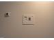 Wall with a thermostat and a control panel at 5118 N Pratt St, Covington, GA 30014