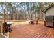 Deck overlooking the backyard. Includes a built-in grill and wooded area at 115 Wellborn Chase, Fayetteville, GA 30215