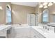 Luxurious bathroom features a soaking tub, shower, and dual sinks at 115 Wellborn Chase, Fayetteville, GA 30215