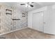 Bedroom featuring wood-look accent wall and white closet doors for a modern aesthetic at 115 Wellborn Chase, Fayetteville, GA 30215