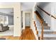 Inviting entryway with hardwood floors and a staircase leading to the upper level at 115 Wellborn Chase, Fayetteville, GA 30215