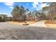 Beautiful two-story home with mature trees and manicured lawn at 115 Wellborn Chase, Fayetteville, GA 30215