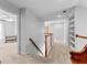 Carpeted upstairs hallway featuring neutral walls and beautiful woodwork at 115 Wellborn Chase, Fayetteville, GA 30215