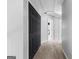 Hallway showcasing carpeted flooring and freshly painted white walls at 115 Wellborn Chase, Fayetteville, GA 30215