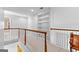 Upstairs hallway with built in book shelves and railing at 115 Wellborn Chase, Fayetteville, GA 30215