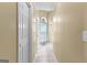 Bright hallway features neutral walls, tile floor and an arched window at 115 Wellborn Chase, Fayetteville, GA 30215
