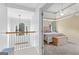 Spacious main bedroom boasts tray ceilings, a ceiling fan, and cozy carpet at 115 Wellborn Chase, Fayetteville, GA 30215