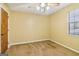 Bedroom featuring ceiling fan, plush carpet, and natural light from a window at 979 Walnut Creek Ln, Jonesboro, GA 30238