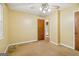 Bedroom featuring ceiling fan, plush carpet, and access to ensuite bathroom at 979 Walnut Creek Ln, Jonesboro, GA 30238