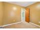 Cozy bedroom with carpeted floors and a doorway to another room at 979 Walnut Creek Ln, Jonesboro, GA 30238