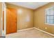 Neutral bedroom offering carpeted floors and natural lighting at 979 Walnut Creek Ln, Jonesboro, GA 30238