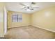 Bedroom featuring ceiling fan, plush carpet, and neutral paint at 979 Walnut Creek Ln, Jonesboro, GA 30238
