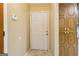 Entryway featuring a white door, neutral walls, and built-in storage cabinets, creating a welcoming first impression at 979 Walnut Creek Ln, Jonesboro, GA 30238