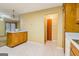 Open eat-in kitchen featuring ample cabinets and breakfast bar at 979 Walnut Creek Ln, Jonesboro, GA 30238