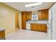 Bright eat-in kitchen showcasing ample cabinets and white appliances at 979 Walnut Creek Ln, Jonesboro, GA 30238