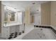 A bathroom featuring a soaking tub, vanity, and checkerboard floor at 1421 Saint Charles Ct, Conyers, GA 30094