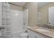 Bathroom featuring granite countertops, a toilet, shower with blue-striped curtain, and a large mirror at 1421 Saint Charles Ct, Conyers, GA 30094