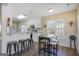 Eat-in kitchen with granite counters, a breakfast bar, white cabinets, and stainless steel appliances at 1421 Saint Charles Ct, Conyers, GA 30094