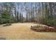Large backyard with mature trees and landscaping, perfect for outdoor activities and gatherings at 9163 Retreat Pass, Jonesboro, GA 30236
