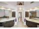 Bathroom showcasing dual vanities, tiled floors, and access to a bedroom at 9163 Retreat Pass, Jonesboro, GA 30236
