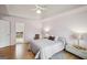 Bedroom featuring a tray ceiling, ceiling fan, and access to an ensuite bathroom at 9163 Retreat Pass, Jonesboro, GA 30236