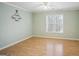 Bedroom featuring wood floors, a ceiling fan, and neutral paint and trim at 9163 Retreat Pass, Jonesboro, GA 30236