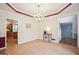 Spacious dining room with hardwood floors, seamlessly connected to the kitchen area, ready for entertaining at 9163 Retreat Pass, Jonesboro, GA 30236