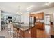 Spacious kitchen with granite counters, stainless steel appliances, island with seating and wood cabinets at 9163 Retreat Pass, Jonesboro, GA 30236