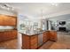 Beautiful kitchen featuring granite countertops, a center island, and hardwood floors, with stainless steel appliances at 9163 Retreat Pass, Jonesboro, GA 30236