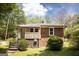 The home's exterior showcases a lovely backyard with stairs and privacy at 2791 Pearl St, East Point, GA 30344