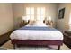 Stylish bedroom featuring hardwood floors, two windows and a cozy aesthetic at 2791 Pearl St, East Point, GA 30344