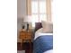 Close up of a stylish bedroom featuring hardwood floors, and mid-century modern nightstand at 2791 Pearl St, East Point, GA 30344