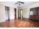 Spacious bedroom features hardwood floors, ceiling fan, closet and vintage built in cabinet at 2791 Pearl St, East Point, GA 30344