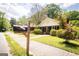 Curb view of quaint home with well-manicured lawn and inviting front entrance at 2791 Pearl St, East Point, GA 30344