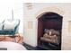 Close-up of the white brick fireplace with a brick arch and dark hearth at 2791 Pearl St, East Point, GA 30344