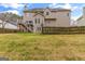 Expansive backyard featuring a deck, fence, and mature trees at 220 Terrane Rdg, Peachtree City, GA 30269