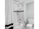Clean bathroom with white subway tile, shower with toiletry shelves, and modern fixtures at 220 Terrane Rdg, Peachtree City, GA 30269