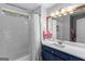 Bright bathroom featuring white subway tile, shower, and a stylish vanity at 220 Terrane Rdg, Peachtree City, GA 30269