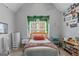 A well decorated bedroom featuring plants, decor and ample storage and natural light at 220 Terrane Rdg, Peachtree City, GA 30269