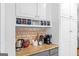 Kitchen countertop with coffee maker, granite countertop, and white cabinets at 220 Terrane Rdg, Peachtree City, GA 30269