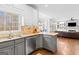 Open kitchen with granite countertops, stainless steel appliances, and island seating at 220 Terrane Rdg, Peachtree City, GA 30269